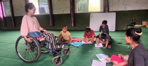 Sabina discipling kids from her wheelchair